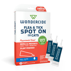 Wondercide cat spot-on being applied for flea prevention on a calm cat