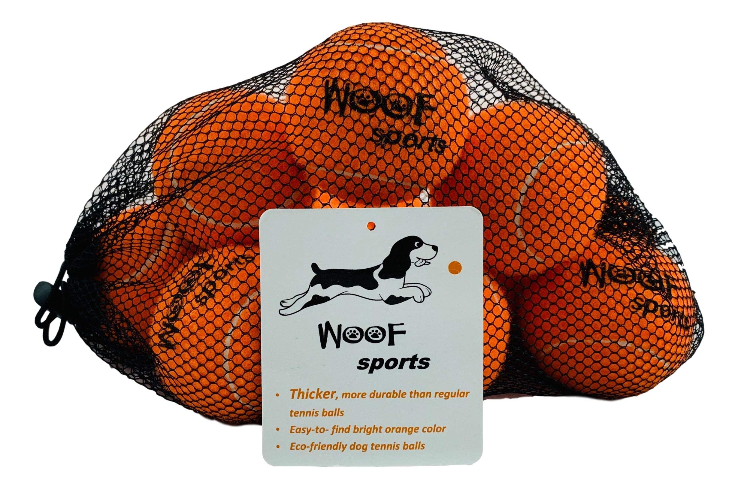 Woof Sports orange-pack dog tennis balls visible in grass for easy fetch
