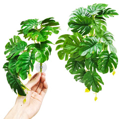 Woyrise fake Monstera terrarium plant two-pack enhances reptile habitat with lifelike leaves.