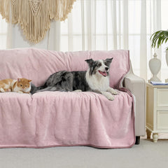 Yaning dusty pink waterproof blanket on sofa guards upholstery from spills and fur.