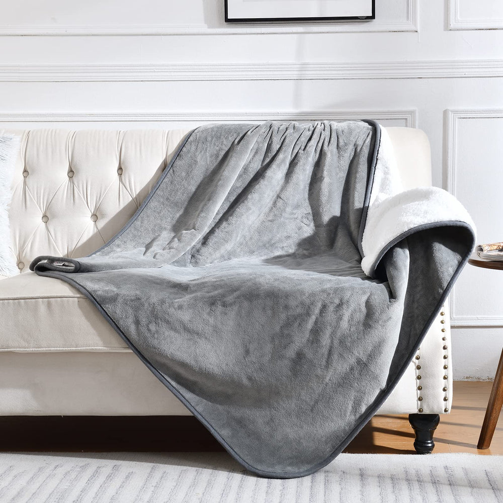 Yaning waterproof blanket on bed provides spill protection and fur resistance.