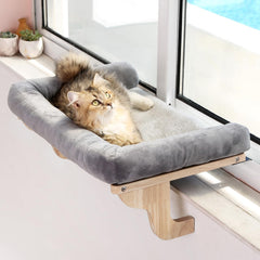 Zakkart cat window perch with bolster on wood frame for sunny naps.