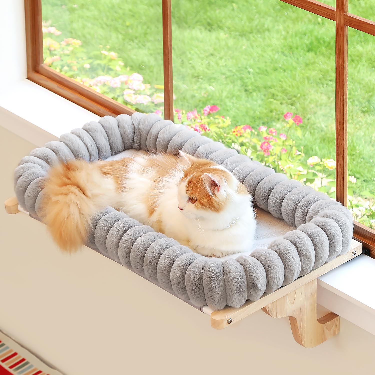 Zakkart SnugCloud window perch provides sunlit, secure lounging for your cat.