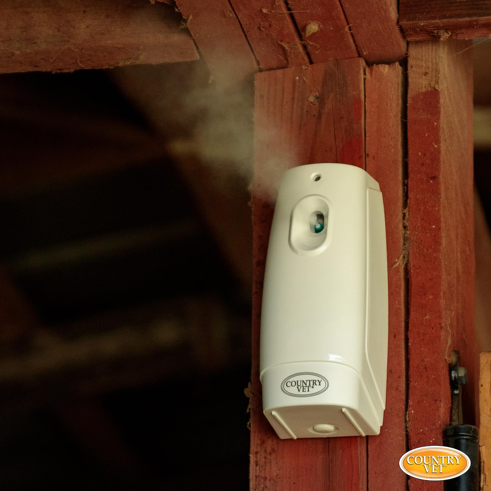 Spray mist close-up illustrating targeted pest control in a stall area.